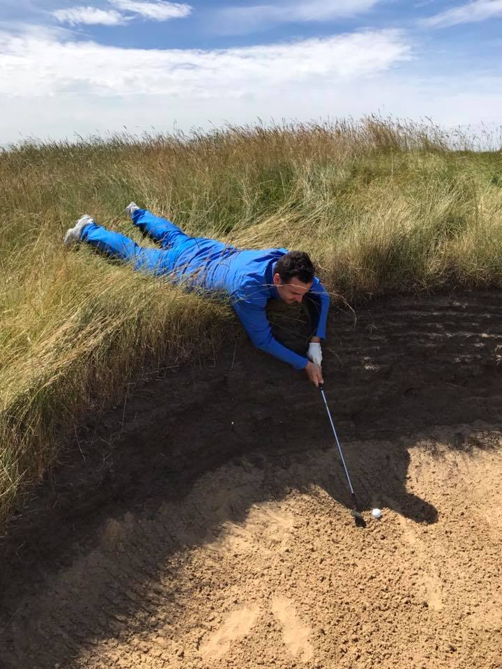 Steve Thom tries to decide how he's going to play out of a bunker at Royal Cinque Ports Golf Club