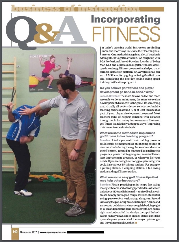 Jaacob Bowden helps a fellow professional perform a downswing band isometric golf fitness exercise